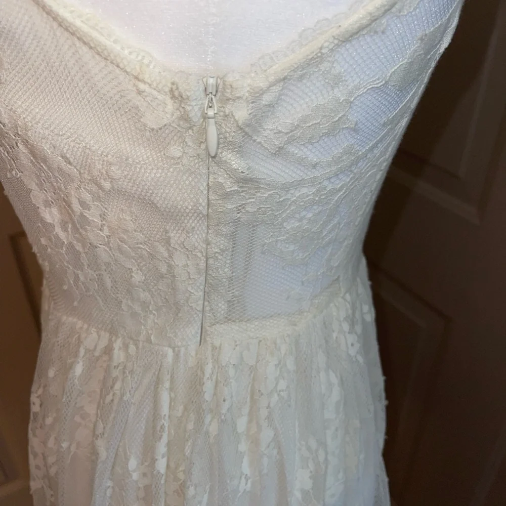 Free People lace mock neck keyhole back fitted flare dress.